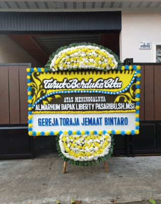 Papan Bunga Duka di Selamat